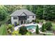 Charming backyard featuring a beautiful in-ground pool, a hot tub and a dining area at 146 Bullfinch Rd, Mooresville, NC 28117