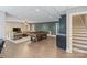 Finished basement with a pool table, lounge area, and access to the stairs at 146 Bullfinch Rd, Mooresville, NC 28117