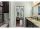 Bathroom showcasing the vanity with granite countertop, sink, and view to the bedroom at 146 Bullfinch Rd, Mooresville, NC 28117