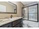 Bathroom featuring granite countertops and a tile shower with a glass enclosure at 146 Bullfinch Rd, Mooresville, NC 28117