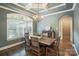 Elegant dining room with large window, chandelier, and stylish furnishings is ideal for gatherings at 146 Bullfinch Rd, Mooresville, NC 28117