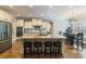 Kitchen with granite countertops, a large island with seating, and stainless steel appliances at 146 Bullfinch Rd, Mooresville, NC 28117