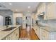 Gourmet kitchen featuring granite counters, stainless appliances, and custom cabinetry at 146 Bullfinch Rd, Mooresville, NC 28117