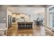 Open-concept kitchen features a large island, stainless steel appliances, and a breakfast nook at 146 Bullfinch Rd, Mooresville, NC 28117