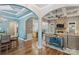 Open-concept living area with stone fireplace and views into the kitchen and dining rooms at 146 Bullfinch Rd, Mooresville, NC 28117