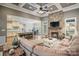 Spacious living room with stone fireplace open to kitchen and dining area, perfect for entertaining at 146 Bullfinch Rd, Mooresville, NC 28117