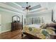 This primary bedroom includes a decorative ceiling, hardwood floors, and large sunny window at 146 Bullfinch Rd, Mooresville, NC 28117
