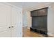 Mud room features custom storage, bench, hooks, and hardwood floors at 146 Bullfinch Rd, Mooresville, NC 28117