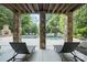 Tranquil outdoor space with a beautiful waterfall feature and stone pillars for an open-air feel at 146 Bullfinch Rd, Mooresville, NC 28117