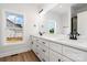 Bright bathroom featuring double vanity, quartz countertop, black hardware, and a window providing natural light at 150 Autumn Blaze Rd, China Grove, NC 28023
