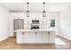 Modern kitchen featuring stainless steel appliances and a large center island at 150 Autumn Blaze Rd, China Grove, NC 28023