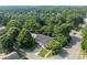 Aerial view of home in lush neighborhood with mature trees and landscaping at 157 Talbert Town Loop, Mooresville, NC 28117