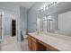 Bathroom featuring a light wood vanity and mirror, toilet, walk-in closet, and walk-in shower at 157 Talbert Town Loop, Mooresville, NC 28117