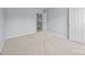 Empty bedroom with neutral carpet and light gray walls at 157 Talbert Town Loop, Mooresville, NC 28117