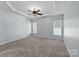 Bedroom featuring neutral colored walls and a trey ceiling with a ceiling fan at 157 Talbert Town Loop, Mooresville, NC 28117