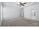 Bedroom featuring neutral colored walls, carpet, and a doorway leading to another room at 157 Talbert Town Loop, Mooresville, NC 28117