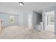 Hallway with neutral carpet and light gray walls leads to multiple rooms at 157 Talbert Town Loop, Mooresville, NC 28117