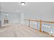 Spacious hallway with wood railing overlooking the lower level at 157 Talbert Town Loop, Mooresville, NC 28117