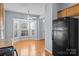 A spacious kitchen featuring a black refrigerator with view into the dining area at 157 Talbert Town Loop, Mooresville, NC 28117