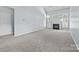 Spacious living room featuring a fireplace, large windows, and neutral wall color throughout at 157 Talbert Town Loop, Mooresville, NC 28117