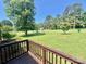 Beautiful backyard view from the porch highlighting lush green space and mature trees on a sunny day at 1678 Nelson Dr, Newton, NC 28658