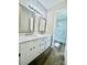 Bathroom featuring double vanity and mirrors, with an open doorway to a spacious shower at 1678 Nelson Dr, Newton, NC 28658