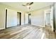 Bedroom with wood-look flooring, ceiling fan and large closet at 1678 Nelson Dr, Newton, NC 28658