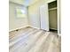 Cozy bedroom with modern floors, a window, and closet at 1678 Nelson Dr, Newton, NC 28658
