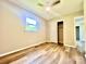 Bedroom featuring a window, wood-look flooring and a sliding door closet at 1678 Nelson Dr, Newton, NC 28658