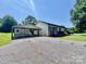 Charming home featuring a carport, shed, and a well-maintained yard at 1678 Nelson Dr, Newton, NC 28658
