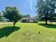 A quaint home on a lush green lawn with mature trees at 1678 Nelson Dr, Newton, NC 28658