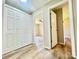 Hallway featuring closets, neutral walls, and doorways to rooms at 1678 Nelson Dr, Newton, NC 28658