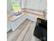 Kitchen with white cabinets, butcher block countertops, and stainless steel appliances; natural light at 1678 Nelson Dr, Newton, NC 28658