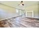 Open living room with hardwood flooring, fireplace, and access to an outdoor patio area at 1678 Nelson Dr, Newton, NC 28658