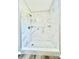 Modern bathroom shower featuring white marble tile, overhead shower head, and built-in shelving at 1678 Nelson Dr, Newton, NC 28658