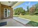 View of a beautiful backyard featuring a well-maintained lawn, a shed, and a concrete patio at 170 Saint James Way, Salisbury, NC 28147