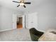 Neutral bedroom with a ceiling fan and an open doorway leading to a dining area at 170 Saint James Way, Salisbury, NC 28147