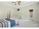 Expansive primary bedroom boasts tray ceiling, access door, and ample natural light at 170 Saint James Way, Salisbury, NC 28147