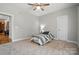 This is a cozy bedroom with neutral tones, a carpeted floor, and access to another room at 170 Saint James Way, Salisbury, NC 28147