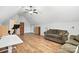 An expansive bonus room with hardwood floors, soft seating, and a desk area at 170 Saint James Way, Salisbury, NC 28147