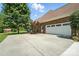 Spacious driveway leads to a two-car garage, complemented by lush landscaping at 170 Saint James Way, Salisbury, NC 28147