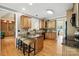 Kitchen with granite countertops, island with seating, wooden cabinets, and stainless steel appliances at 170 Saint James Way, Salisbury, NC 28147