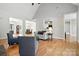 Open-concept living room with hardwood floors, dining area, and natural light at 170 Saint James Way, Salisbury, NC 28147