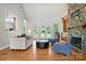Bright living room features hardwood floors, stone fireplace, and glass doors to the backyard at 170 Saint James Way, Salisbury, NC 28147