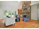 Inviting living room with a stone fireplace, built-in shelves, and ample seating at 170 Saint James Way, Salisbury, NC 28147