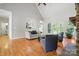Bright living room featuring hardwood floors, French doors, and a view to the kitchen at 170 Saint James Way, Salisbury, NC 28147