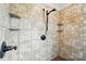 Walk-in shower showcasing decorative stone features and a rainfall showerhead at 170 Saint James Way, Salisbury, NC 28147