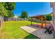 A spacious backyard features a wood pergola and ample grass area with a perimeter fence for privacy at 1706 Baylor Dr, Rock Hill, SC 29732