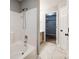 Bright bathroom featuring tub/shower combo and view into walk-in closet at 1706 Baylor Dr, Rock Hill, SC 29732
