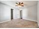 Spacious bedroom featuring carpet, neutral paint, ceiling fan and access to a closet and ensuite bathroom at 1706 Baylor Dr, Rock Hill, SC 29732